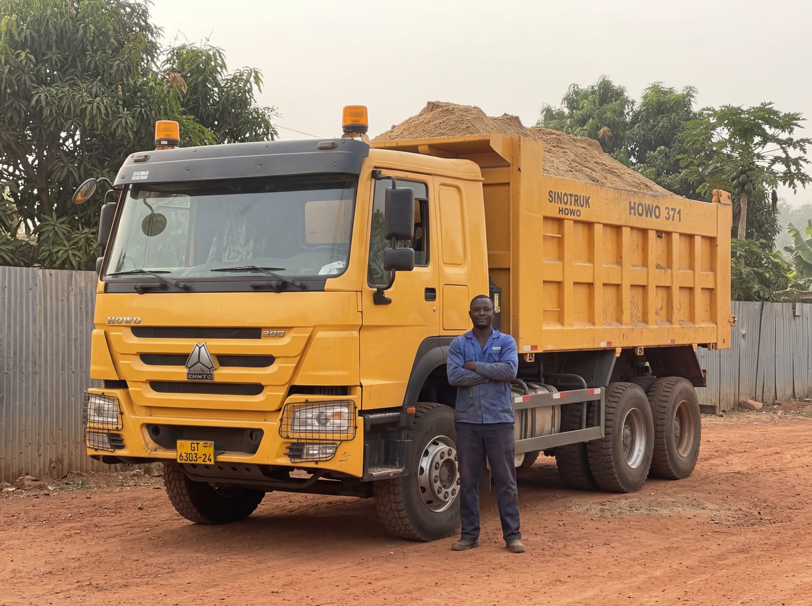 Loaded Elim Haul tipper truck, three-quarter front view, number plate readable, driver by the cab